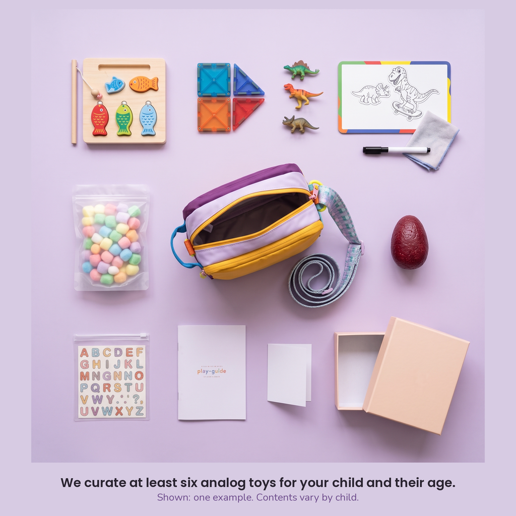 The Analog Bag, customised: one example of what goes inside, laid out flat. We curate at least six analog toys for your child and their age. Contents vary by child.